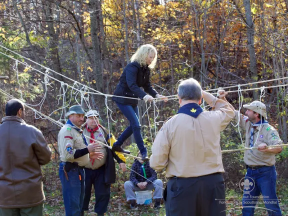 Sabine Bosman (ZA) testing out the hand made rope bridge.