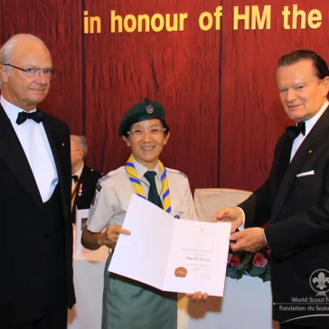 Ms Pinky POON (HK) presented to His Majesty as a new BP Fellow