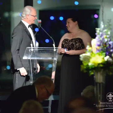 Cub Scout Sam Mouser (AU) (represented by his mother) presented to His Majesty as a new BP Fellow