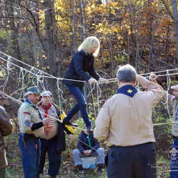 Sabine Bosman (ZA) testing out the hand made rope bridge.