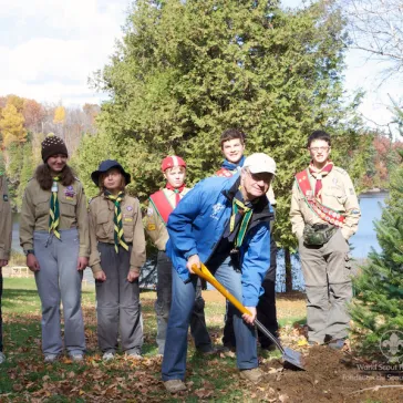 His Majesty planting a tree at the Scout Camp