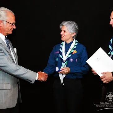 Dr Monica Hernandez de Phillips (EC) presented to His Majesty as new B-P Fellow.