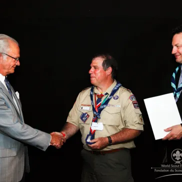 Rev Carl Hogsten, Jr (US) presented to His Majesty as new B-P Fellow.