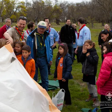 Assisting in setting up a patrol tent.