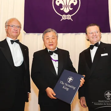 Mr Sung Hak Baik (KR) - Regal Circle Member - receives a signed copy of the anniversary book