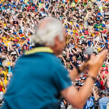 HM The King leading 40'000 Scouts in song/sketch