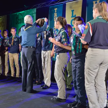 30 recipients of the Scouts Australia Medellion (for Scouts age) receiving their awards from His Majesty