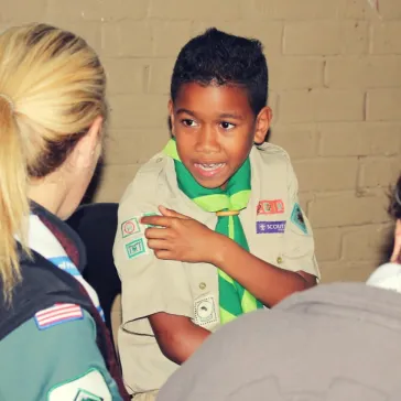 Listening to the story of why this Scout joined Scouting in the Township and not one of the gangs